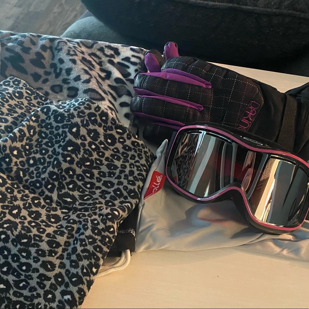 Ski goggles gloves and neck gaiters snow winter